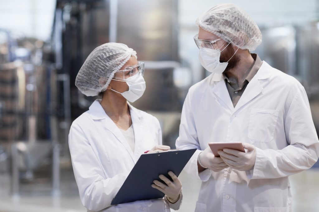 Two Workers at Pharmaceutical Factory